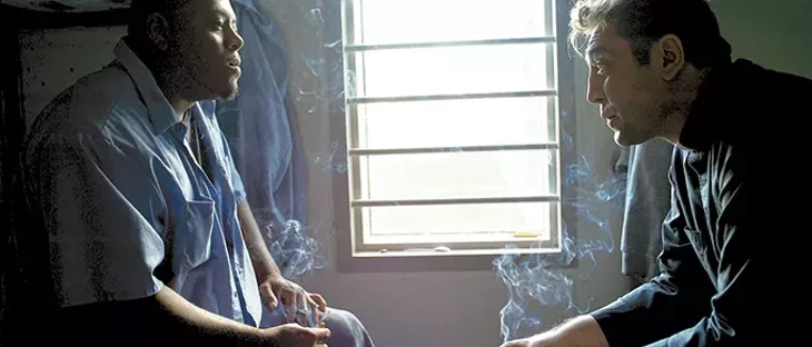 right Actor Javier Bardem speaks with an Osage County Jail inmate during the filming of Thy Kingdom Come. - PROVIDED