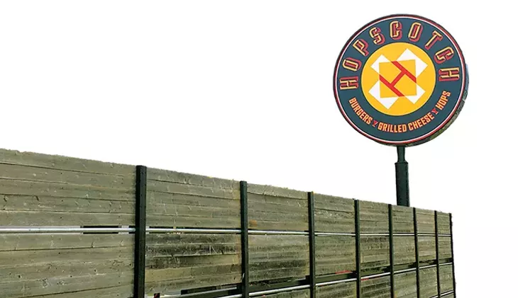A new patio wall gives guests a shield from busy May Avenue traffic. - JACOB THREADGILL
