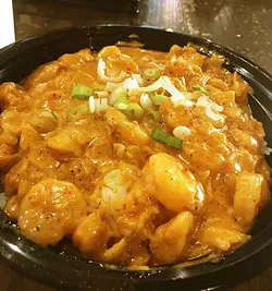 The cream sauce seafood étouffeé is served over jasmine rice. - JACOB THREADGILL