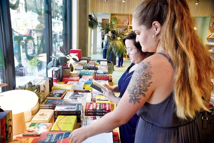 Asheley Middleton and Jenna Swanson browse for reading material at Commonplace Books. - JACOB THREADGILL