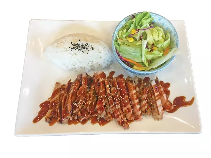 Chicken teriyaki thigh meat with rice and salad, a standard teriyaki plate order - JACOB THREADGILL