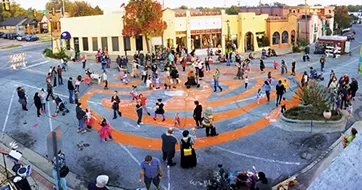 Magic Lantern ends with a parade through a pumpkin-shaped labyrinth painted in the street. - PAIGE POWELL / PROVIDED