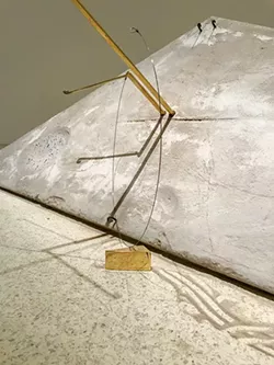 Threshold With Me is constructed of steel, brass rods, concrete and piano wire. - FRED JONES JR. MUSEUM OF ART / PROVIDED