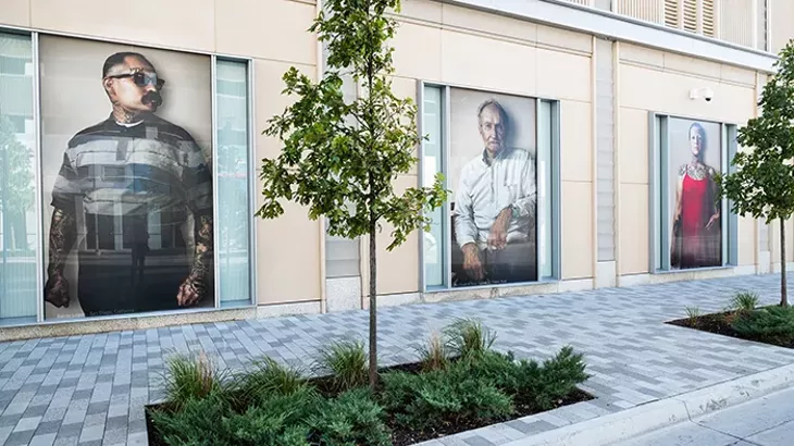 Portraits from photographer John Raymond Mireles’ Neighbors Project are on display outside the BOK Park Plaza building at the intersection of N. Walker and W. Sheridan avenues until April 15. - JOHN RAYMOND MIRELES / PROVIDED