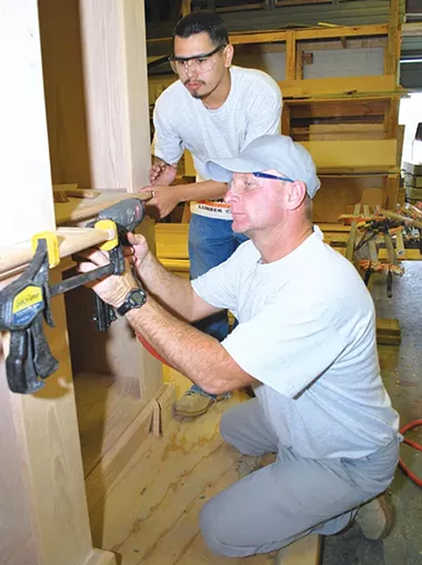 A student works with his teacher at a CareerTech center. - CAREERTECH / PROVIDED