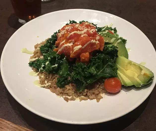 Tuna poke was served on warm and slighly wilted kale, which raised the temperature of the raw tuna. - JACOB THREADGILL