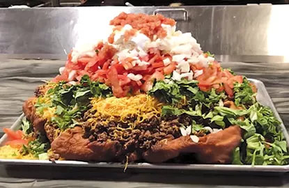 The 13.5-pound Indian taco at The Miller Grill is the largest food challenge in the Oklahoma City area, if not the country. - ROBERT MCKINNEY / PROVIDED