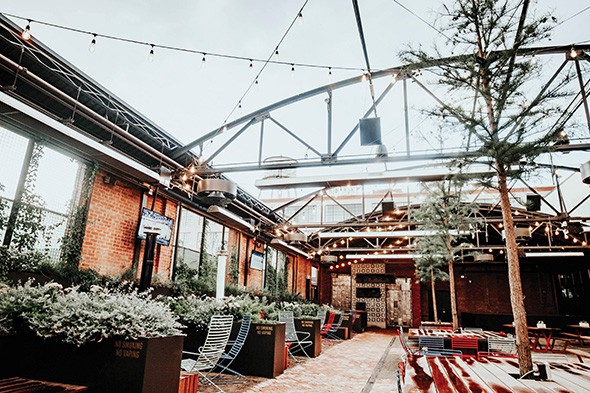 The Jones Assembly’s event menu features food you can walk around with, including margherita pizza, a roasted pork sandwich and herb frites with goat cheese and bacon. - PROVIDED