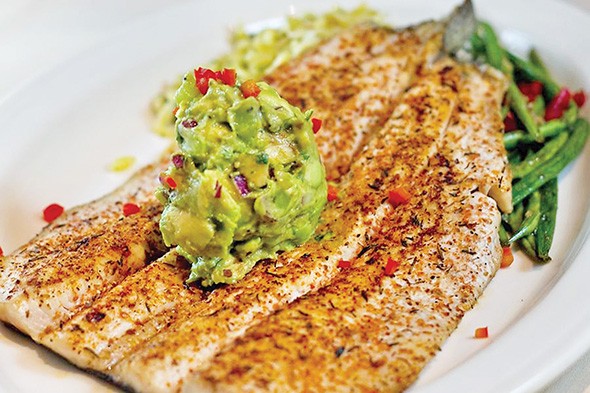 The blackened trout is topped with an avocado kiwi salsa that is like a sweet guacamole. - PASEO GRILL / PROVIDED