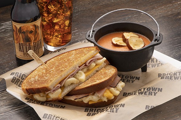The new Twisted Comfort Foods grilled cheese features ham and macaroni and cheese with San Marzano tomato soup. - PROVIDED