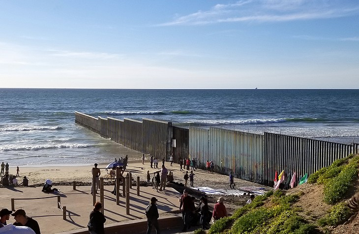 Migrants gather at the border at Playa de Tijuana, Baja California, Mexico. - PHOTO BIGSTOCK.COM
