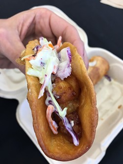 Hot Chick by Cheese Curd Tacos is grilled chicken, fried cheese curd, blue cheese coleslaw and Buffalo sauce in a fried tortilla. - JACOB THREADGILL
