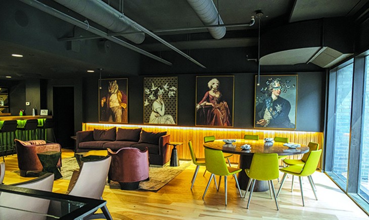 Artwork overlooks the second story of Bar Cicchetti that blends dining and lounge areas. - PHILLIP DANNER