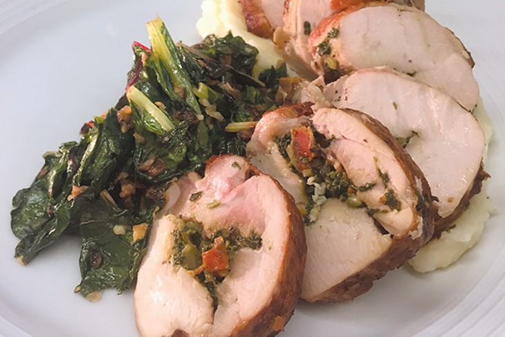 Chicken roulade from Budweiser Brewhouse is stuffed with sundried tomato pesto. - JACOB THREADGILL