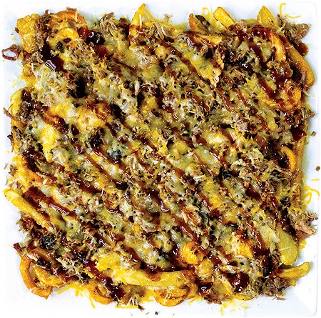Holy Smokes — more than 2 pounds of a mixture of fry preparations topped with pulled pork, sauce and cheese - ALEXA ACE