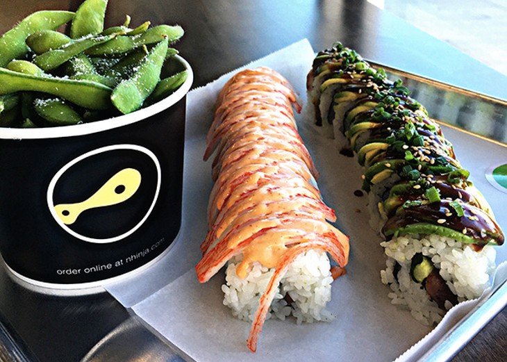 Thunder and Tiger rolls made with the help of two automated machines at Nhinjo Sushi and Grill in Moore. - JACOB THREADGILL