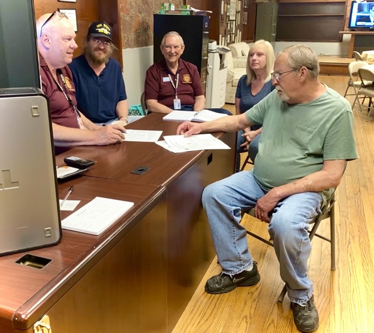 Members of the Norman American Legion Post 88, assisting one of their fellow vets. From left are: Post 88 Senior Veterans Service Officer Carl Ellison, and VSOs Coy Hensley, Harley McPeek and Tammie Richard. - PROVIDED BY NORMAN AMERICAN LEGION POST #88
