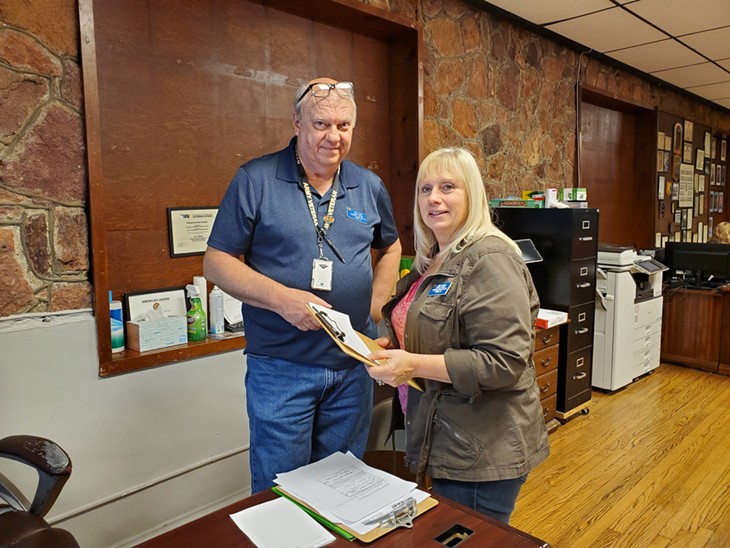 Carl Ellison, senior veterans service officer for the Norman American Legion Post #88, consults with fellow VSO Tammie Richard. - PROVIDED BY NORMAN AMERICAN LEGION POST #88