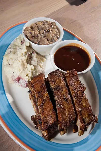 KD's Southern Cuisine's Barbecue Pork Ribs with Mashed Red Potatoes and Black-eyed Peas. mh