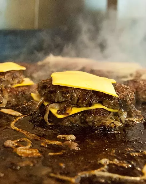 Double Onion Burger on the grill (Mark Hancock)