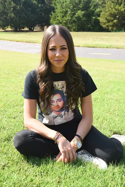 Mandi Leegard poses with her deceased boyfried's picture on a tee shirt, in the back yard of her Coffee Creek, Edmond home, 10-7-15. - MARK HANCOCK