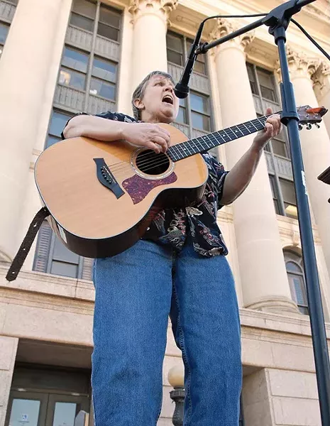Mary Catherine Reynolds belts out a rendition of "This Land is Your Land" to open the rally for the expansion of Medicaid held on the north steps of the Oklahoma State Capitol, 2-5-13. mh
