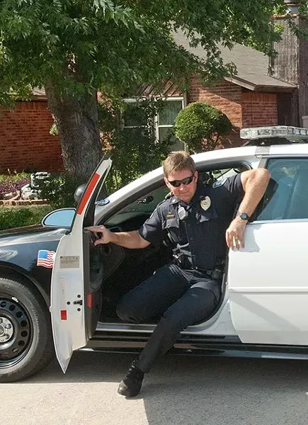 Community Action Officer Roland "Rollie" Branham arrives in a Midwest City neighborhood to visit with residents on Big Oak Drive. mh