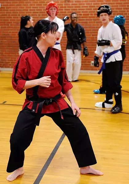 Jennifer Allman does a demonstration for her Martial Arts students at Harding Fine Arts Academy in Oklahoma City, Wednesday, Jan. 21, 2015. - GARETT FISBECK