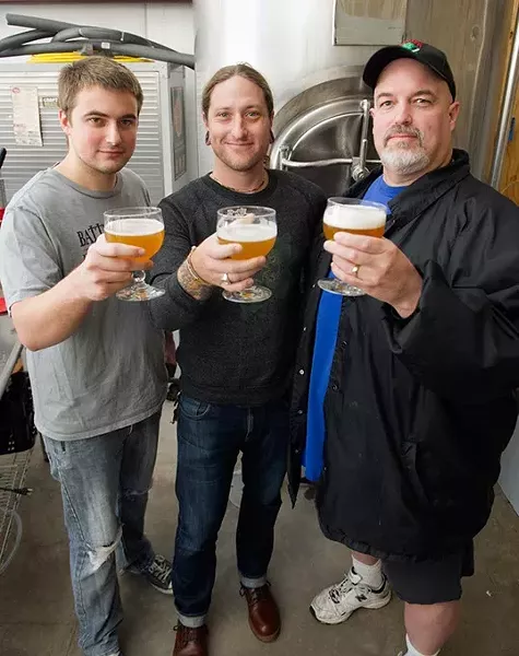 Jordan Sandefur, Chris Gaylor, and Mike Sandefur toast to a great brew at Battered Boar Brewery in Edmond, OKla. Chris Gaylor, the drummer for The All American Rejects, is the brewery's investor. Photo by Lauren Hamilton - LAUREN HAMILTON