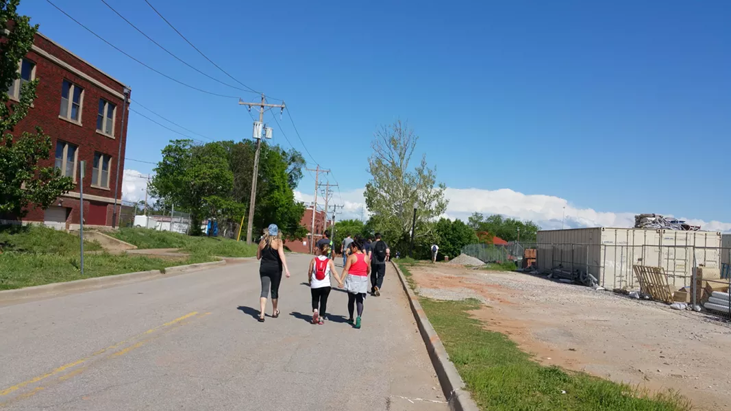 Some downtown streets were without sidewalks, demonstrating the work left to do to increase Oklahoma City's pedestrian infrastructure. - BEN FELDER