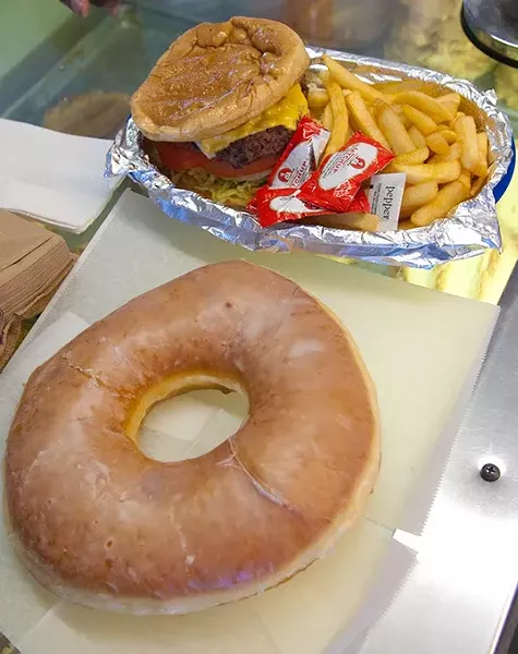 Yes, that donut is actual size, next to a cheeseburger and fries basket at Geronimo Bakery (Mark Hancock)