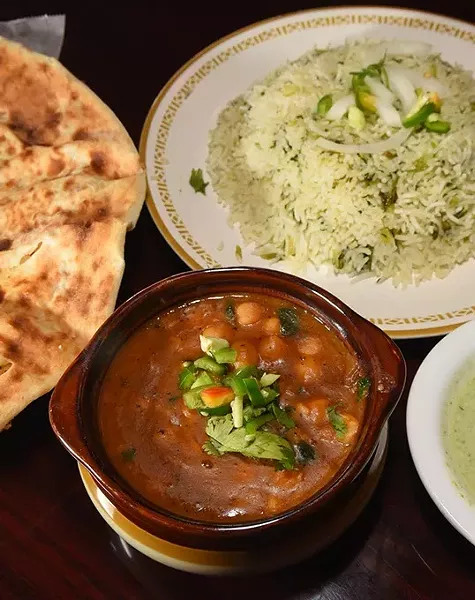 Chana Masala with green rice and hot green sauce and naan bread, at Sheesh Mahal. mh