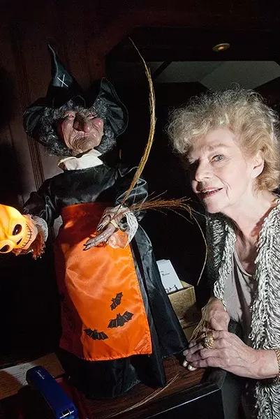 Hounted House owner Marian Thibault poses with a Witch of course, last October at the Haunted House. mh