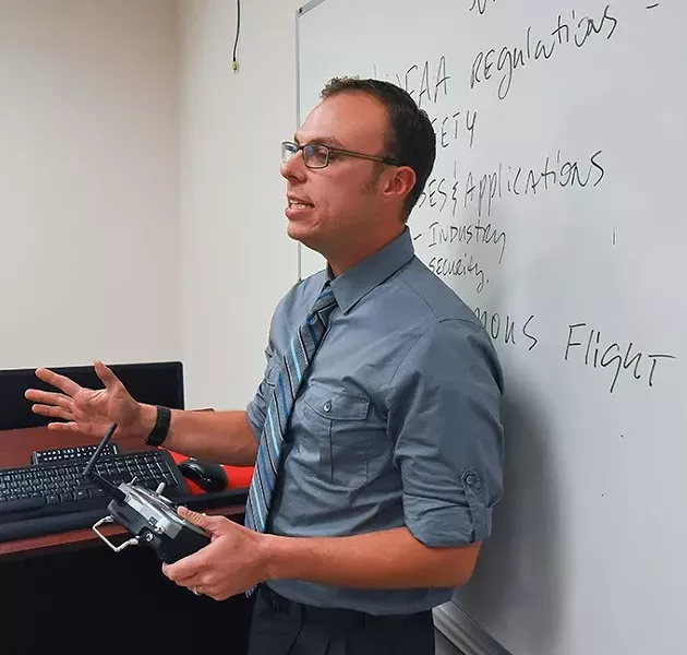 Instructor Shane Snyder during a free two-hour sUAS (Drone) operator orientation class at OCCC's Professional Development Institute located off the main campus in the Plaza Major at the Crossroads Mall area, 11-9-15. - MARK HANCOCK