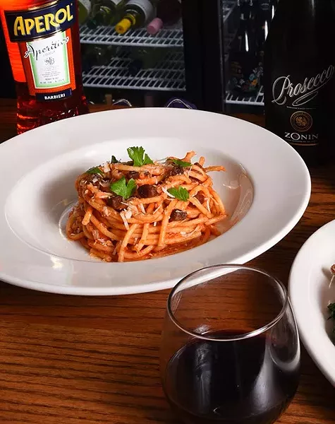 Bucatini Amatriciana pasta, with Pinnacoli red wine and other drinks, at Patrono, 11-10-15. - MARK HANCOCK