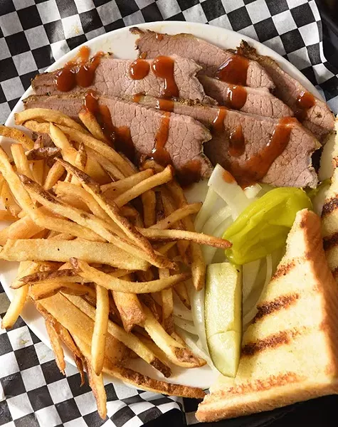 The Lunch Meat Special featuring sliced brisket and fries, at Blu's BBQ and Burgers. mh