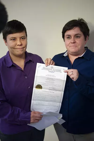 First gay couple to get their marriage license at the Ok. County Courthouse, Sara Yarbrough, left, and Lauren Tidwell, display their Marriage License at the Coutny Courthouse Monday, 10-6-14. mh