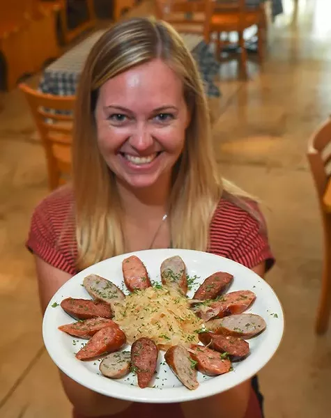 :aira G,eomer. GM at Das Boot Camp on Main Street in Norman, with the Grilled Sausage Appitizer plate. mh