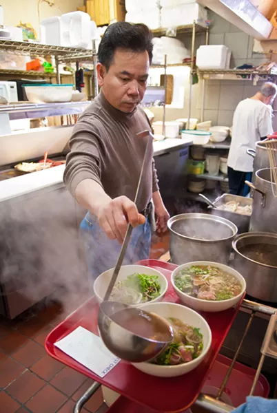 Duy Tran cooks everything from scratch in the kitchen at Pho Cuong. mh