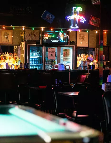 The bartender at Partners 4 Club sitsbehind the bar waiting for customers to come in on Friday, June 9, 2017. (Cara Johnson).