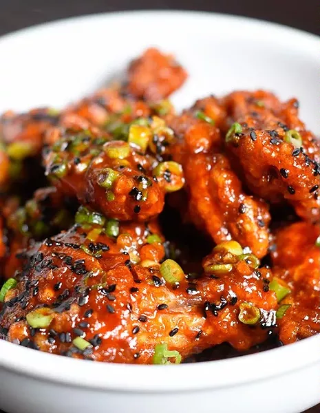 Gochujang wings for Paul Langer's new concept Chicken & Beer, Tuesday, May 17, 2016. - GARETT FISBECK
