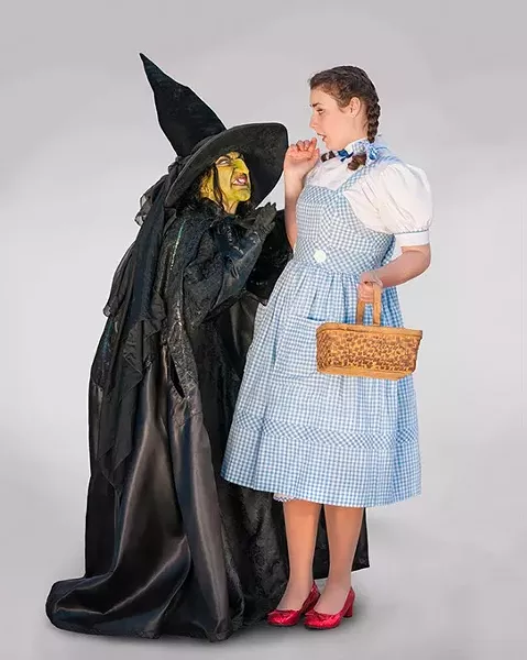 Renee Anderson as the Wicked Witch of the West and Arden Walker as Dorothy. Photo by KO Rinearson - KO RINEARSON