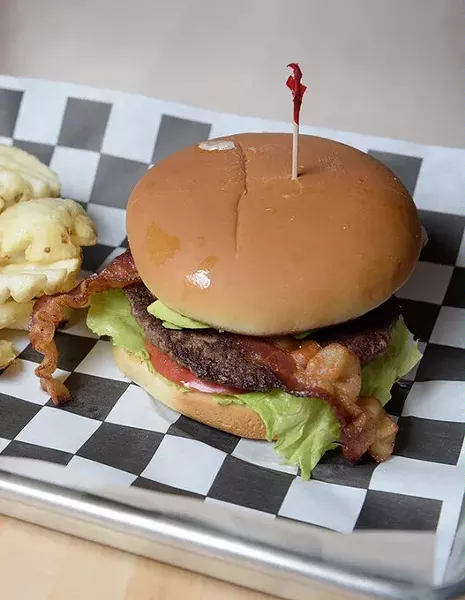 Aikman Bacon Avacado Burger with Waffle Fries at 1907 Burgers & Brews in Moore, Friday, Sept. 23, 2016. - GARETT FISBECK