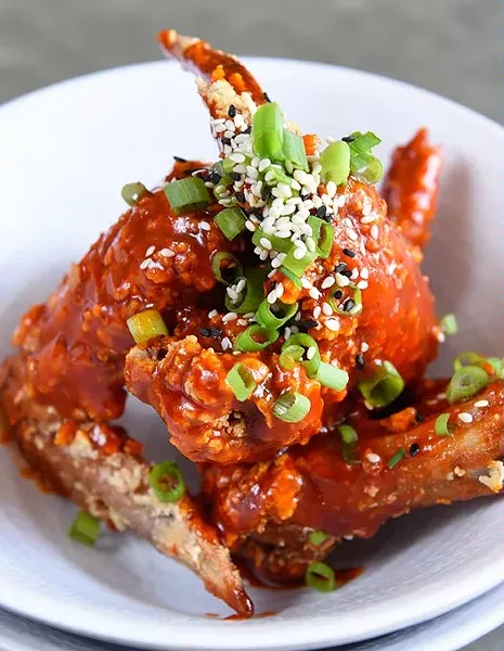 Chicken Wings in spicy sauce at Chae Modern Korean, Wednesday, May 11, 2016. - GARETT FISBECK