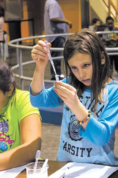 A child participates in a DNA extraction activity during a CSI Science Overnight at Science Museum Oklahoma. | Photo Science Museum Oklahoma / provided