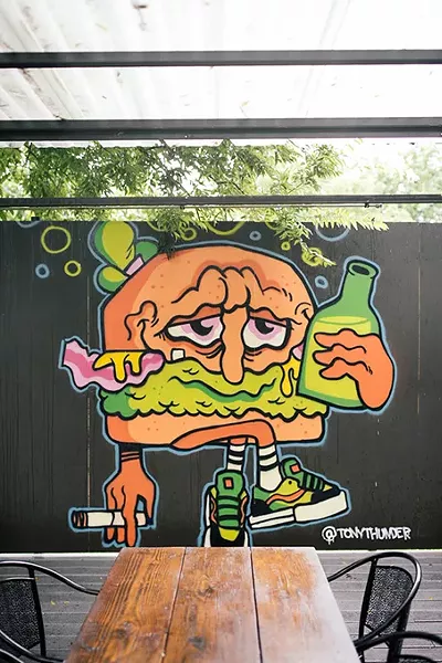 Graffiti is encouraged and beer is - cheap at Good Times. - ALEXA ACE