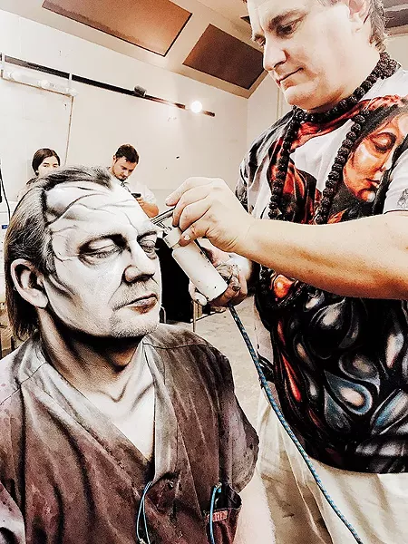 Jim Baughman sits for makeup at The Sanctuary. - JO LIGHT