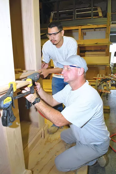 A student works with his teacher at a CareerTech center. - CAREERTECH / PROVIDED