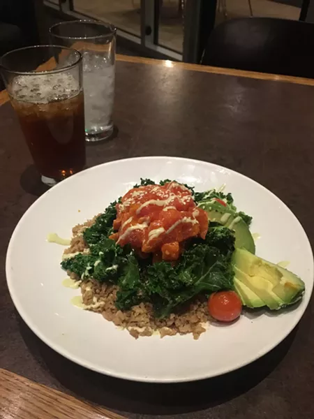 Tuna poke was served on warm and slighly wilted kale, which raised the temperature of the raw tuna. - JACOB THREADGILL