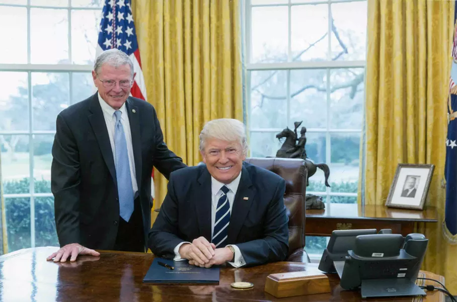 U.S. Sen. Jim Inhofe, R-Oklahoma, poses with President Donald Trump. Inhofe claims that Consumer Fraud Protection Bureau regulations are causing banking fees to rise. - PROVIDED